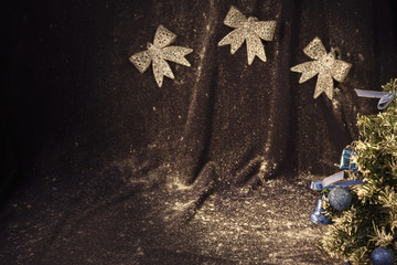 small  Christmas tree on background for postcards and greetings for the New Year and Christmas