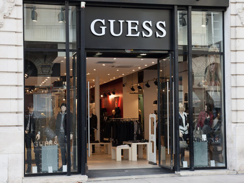 Guess sign store American upscale clothing line brand logo shop