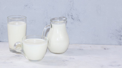Fresh simple homemade kefir drink on a gray concrete background with copy space. Probiotic cold sour milk drink, the concept of a healthy diet, maintaining a healthy intestinal microflora,diet food,