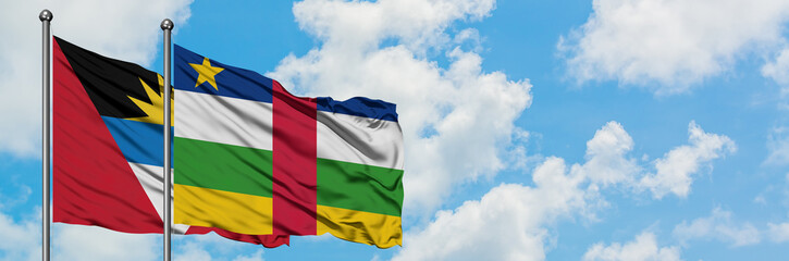 Antigua and Barbuda with Central African Republic flag waving in the wind against white cloudy blue sky together. Diplomacy concept, international relations.