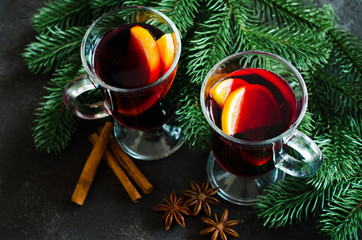 Christmas mulled red wine with spices on dark background