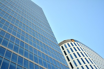 Panoramic and perspective wide angle view to steel light blue background of glass office building commercial modern city of future. Business concept of success industry tech architecture. 