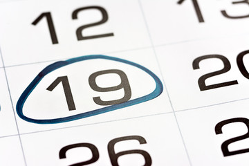 nineteenth day of the month highlighted on the calendar with a red frame close-up macro, mark on the calendar, nineteenth date