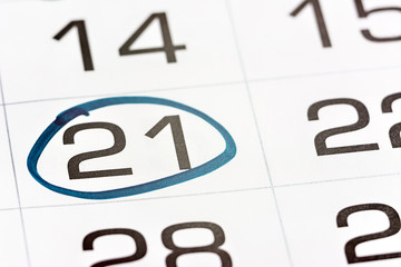 the twenty-first day of the month highlighted on the calendar with a frame close-up macro, a mark...