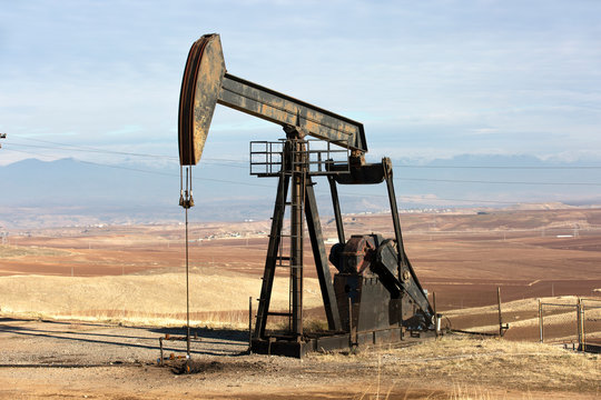 View of Oil Well Pumpjack (Horsehead) at Daylight Oil Industry