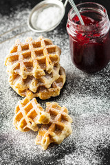 Belgian waffles sprinkled with sugar.