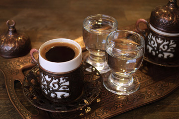 Cup of traditional Turkish coffee with water.