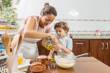 A woman and a child cooking together.