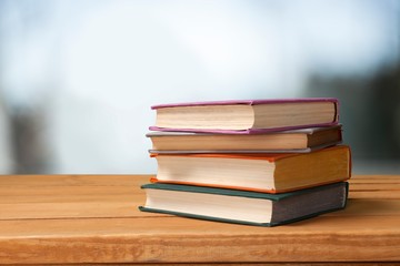 Books collection in pile on  background.
