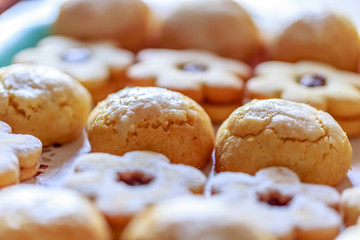shortbread and coconut biscuits on a wood background