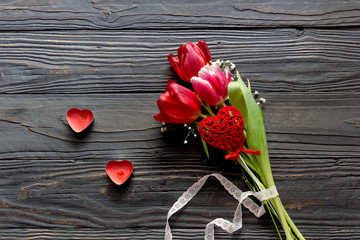 Romantic bouquet of tulips and red candles