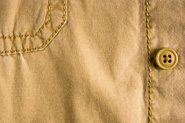 clothing items stonewashed cotton fabric texture with seams, clasps, buttons and rivets, macro