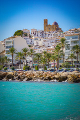 ALTEA, SPAIN - OCTOBER 4, 2019: Beautiful houses in Altea with tourist attractions and turquoise sea