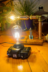 Light fixtures handmade in vintage style, retro film SLR camera case and wooden case,