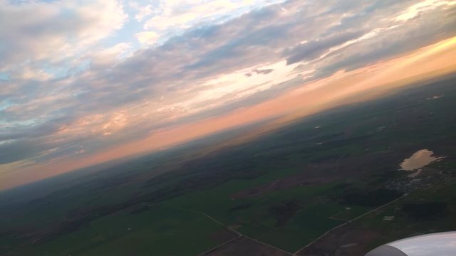 Airplane are taking off from Kaunas airport, Lithuania at morning during beautiful sunset through sun rays in sky. PART 3