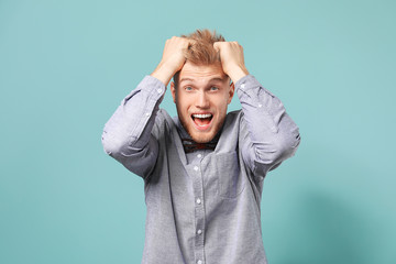 Portrait of screaming man on color background