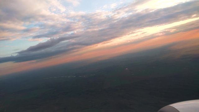 Airplane are taking off from Kaunas airport, Lithuania at morning during beautiful sunset through sun rays in sky. PART 4 