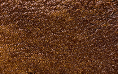 Old vintage genuine soft brown leather texture background, top layer with pores and scratches,...
