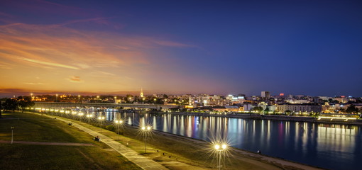 Fototapeta na wymiar Belgrade, Old City, New Belgrade, Cathedral, Branco's Bridge Sava River Sunset, City Lights Water Reflections 