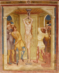 Obraz premium l'Imperatore Massenzio fa flagellare Caterina. Storie di Santa Caterina d'Alessandria; affresco esterno della chiesa di Santa Caterina a Breien (Val di Tires, Bolzano)