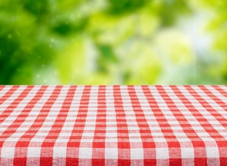 Worn table and blur with bokeh grass background