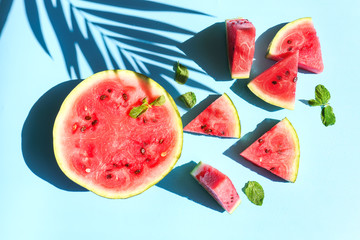 Tasty watermelon with mint on color background