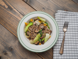 Soba noodle vegetable pan with pak choi - copy space
