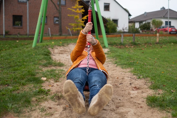 Caucasian woman having fun in zip line outdoor