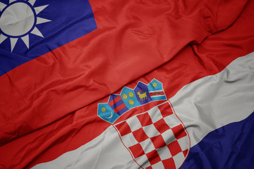 waving colorful flag of croatia and national flag of taiwan.
