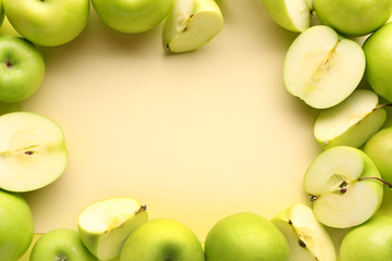 Frame made of ripe apples on light background
