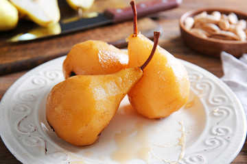 Tasty cooked pears on plate