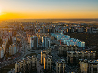 Fototapeta premium Sunset above modern residential area in Voronezh, aerial view from drone