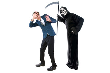 Man in a Halloween grim reaper ghost costume chasing, mocking and making fun of scared businessman...