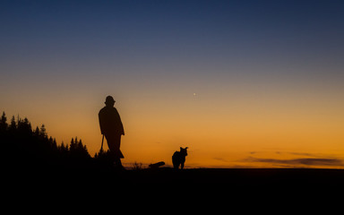 Fototapeta na wymiar silhouette of man on top of mountain