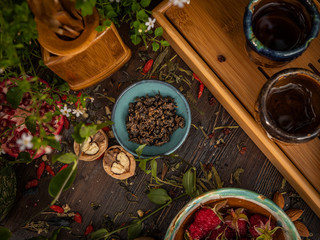 Preparation of the tea ceremony, tea in the bowl. Handmade cups