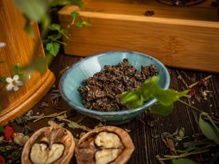 Preparation of the tea ceremony, tea in the bowl. Handmade cups