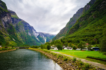 Fototapeta na wymiar Small village on the coast of Sognefjord, one of the most beautiful fjords in Norway