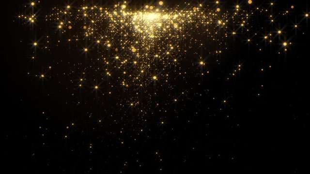 Fiery golden glowing star-like particles falling down over black background.