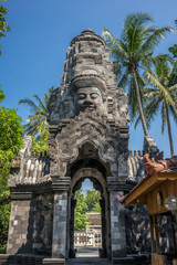 Tower gateway surmounted by four stone faces of Bodhisattva Lokeshvara. Mendut Buddhist Monastery (Vihara Mendut) located next to Mendut Temple