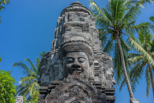Tower gateway surmounted by four stone faces of Bodhisattva Lokeshvara. Mendut Buddhist Monastery (Vihara Mendut) located next to Mendut Temple