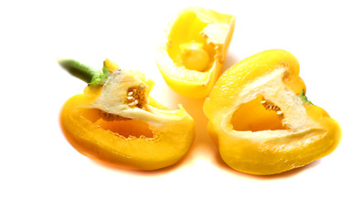 Fototapeta na wymiar paprika, yellow pepper in a bowl isolated on white, source of vitamins