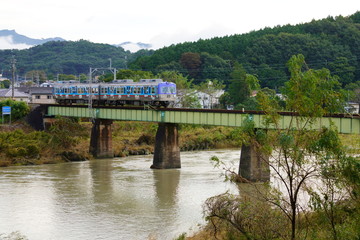 Fototapeta na wymiar ローカル線の鉄橋と無人駅