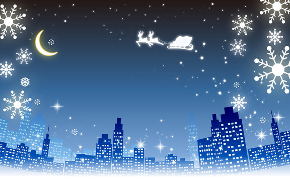 クリスマスイメージ素材・都市夜景とプレゼントを運ぶサンタとトナカイシルエット・雪の結晶