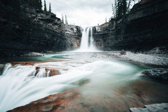 Water streaming down rocks in Ram River Falls, Nordegg, Alberta.