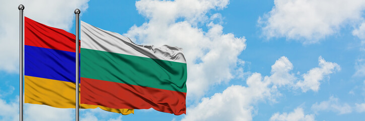 Armenia and Bulgaria flag waving in the wind against white cloudy blue sky together. Diplomacy concept, international relations.
