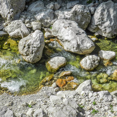 Naklejka na ściany i meble Rocks and stones in the river.