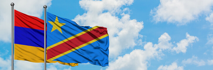 Armenia and Congo flag waving in the wind against white cloudy blue sky together. Diplomacy concept, international relations.