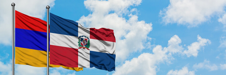 Armenia and Dominican Republic flag waving in the wind against white cloudy blue sky together. Diplomacy concept, international relations.