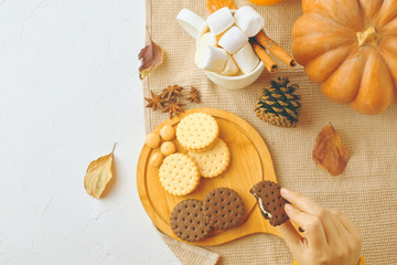 Woman eating cookies. girl drinking her coffee, eat cookies. Christmas time