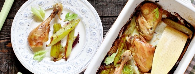 baked chicken pieces with celery stalk. chicken with celery. top view. copy space. keto recipe, low carb